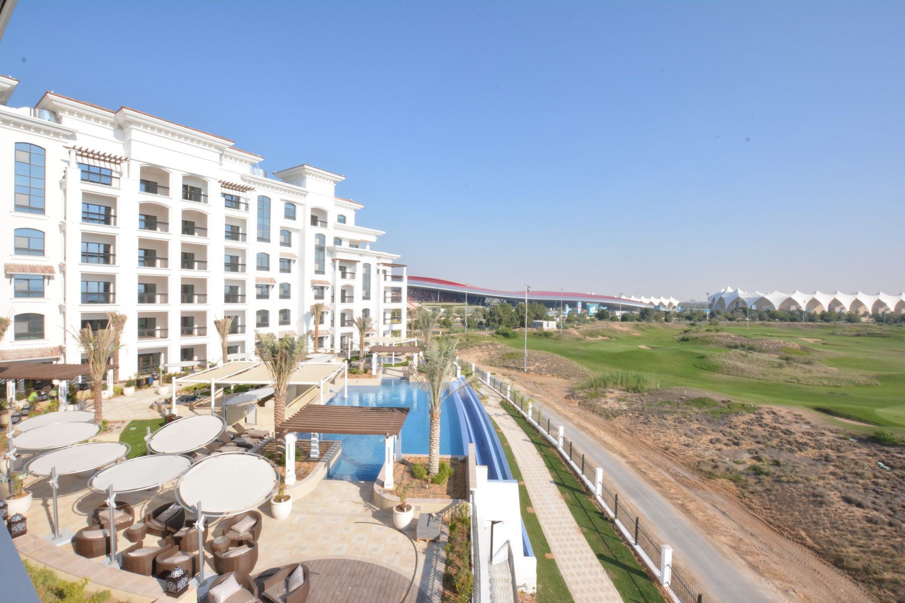 Ansam community on Yas Island, Abu Dhabi featuring residential architecture, greenery and inviting landscaped outdoor areas
